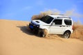 Off-road vehicle traveling in the desert Royalty Free Stock Photo