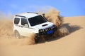 Off-road vehicle traveling in the desert Royalty Free Stock Photo