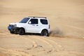 Off-road vehicle traveling in the desert Royalty Free Stock Photo