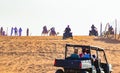 Off road vehicles and camels riding at desert safari  Dubai  UAE Royalty Free Stock Photo