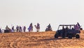 Off road vehicles and camels riding at desert safari  Dubai  UAE Royalty Free Stock Photo