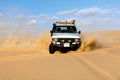 Off-road vehicles driving in Sahara sand desert Royalty Free Stock Photo