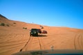 Off-Road vehicles roading on dune in a desert safari trip in Al Madam desert in Sharjah, UAE