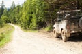 Off road 4x4 adventure, jeep on mountain dirt road. Copy space for text