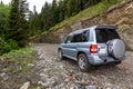 Off-road 4x4 car driving on a narrow gravel road to Zekari Pass (Meskheti Range), Georgia Royalty Free Stock Photo