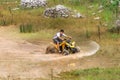 Off road on 4x4 quad bike through mud puddle Royalty Free Stock Photo