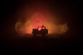 Off roader jeep silhouette on dark toned foggy sky background. Car with light at night Royalty Free Stock Photo