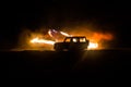 Off roader jeep silhouette on dark toned foggy sky background. Car with light at night