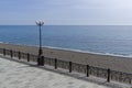 Off-season. Empty embankment and empty beach. Crimea.