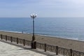 A lonely man walking along the surf line on an empty beach. Royalty Free Stock Photo