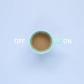 On and Off switch button. Cup of coffee on pastel purple background Royalty Free Stock Photo