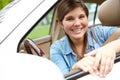 Off to her first day of college. A pretty young girl sitting behind the wheel of her brand new car. Royalty Free Stock Photo