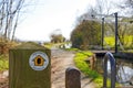 Offa`s Sign Post and Lift Bridge on Montgomery Canal, Powys, Wales Royalty Free Stock Photo