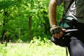 Offcenter bicyclist with bare forearm resting on hip