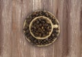 ÃÂ¡offee beans and a cup on a wooden background. Coffe cup with copy space for text. Royalty Free Stock Photo