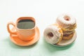 ÃÂÃÂ¡offee break. Orange cup with coffee and a plate from donats Royalty Free Stock Photo