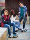 Offended boy and couple of teens apart Royalty Free Stock Photo