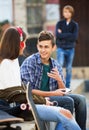 Offended boy and couple of teens apart Royalty Free Stock Photo