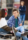 Offended boy and couple of teens apart on the street Royalty Free Stock Photo