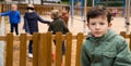 Offended boy on playground Royalty Free Stock Photo