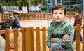 Offended boy on playground Royalty Free Stock Photo