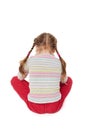 Offended child sitting on floor,back view