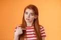 Offended innocent timid redhead girl hurt feelings, hear upsetting accusations, pointing herself frowning, look insulted