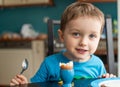 Offended little boy refuses to eat dinner Royalty Free Stock Photo