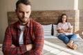 Offended man and woman in bedroom Royalty Free Stock Photo