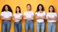 Offended Multiracial Females Group Crossing Hands Posing On Yellow Background