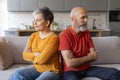 Offended Senior Couple After Quarrel Sitting Back To Back On Couch Royalty Free Stock Photo