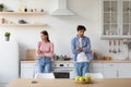 Offended young european lady and man silent with crossed arms on chest, ignore spouse after quarrel