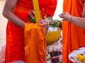 Offer sacrifice flowers to monk