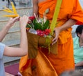 Offer sacrifice flowers to monk