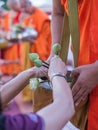 Offer sacrifice flowers to monk