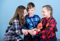 Offering healthy foods for kids. Little children holding red apples. Cute children with healthy apple snack. Small group Royalty Free Stock Photo