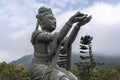 Offering from one of the six devas surrounding the Big Buddha at Ngong Ping, Lantau Island Royalty Free Stock Photo