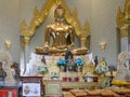 Offerings at Golden Buddha statue in Phra Maha Mondop | Wat Traimit , Bangkok Royalty Free Stock Photo