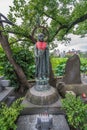 Offerings placed at Monument of Jizo or Ksitigarbha. Located in front of Shinobazu Bentendo temple