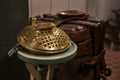 Offertory box made of brass with an iron lock in a Christian church, used to collect money for charitable or religious purposes