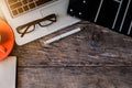 Office accessories laptop, smartphone, notepad, and coffee cup on a wooden table background. Royalty Free Stock Photo