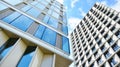 Office building, blue glass wall reflection detail. Modern office building and clear sky background. Royalty Free Stock Photo