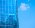 office building with blue sky and clouds in window reflection Royalty Free Stock Photo