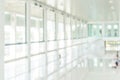 Office building blur background business lobby reception hall interior or empty indoor foyer meeting room with blurry light