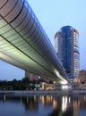 Office building with bridge at night