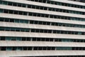 Rows of windows in concrete facade office building Royalty Free Stock Photo
