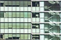 Office building in capital or big city with many glass window and blind or curtain to protect from sun ray.