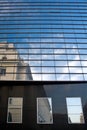 Office building with clouds reflection in windows Royalty Free Stock Photo