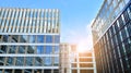 Office building, details of blue glass wall and sun reflections. Royalty Free Stock Photo