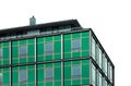 an office building with a green glass facade, which is not much visible Royalty Free Stock Photo